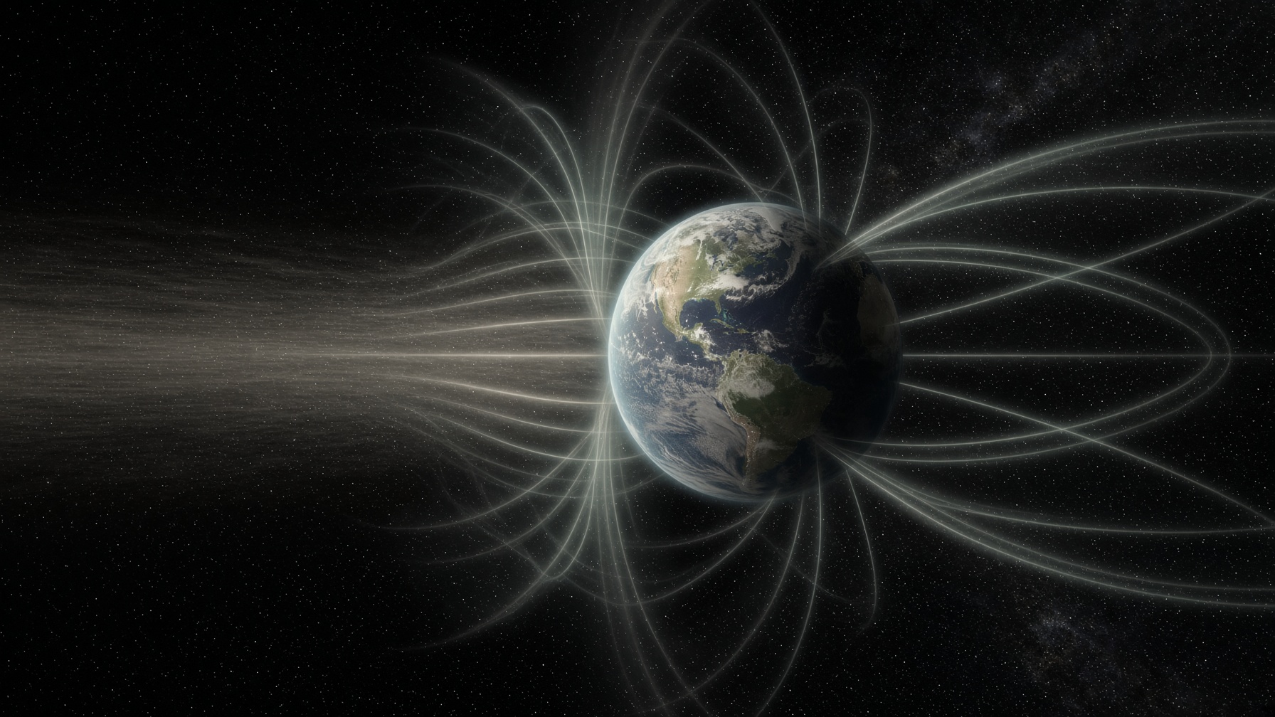 Earth wrapped in magnetic field lines, deflecting solar wind